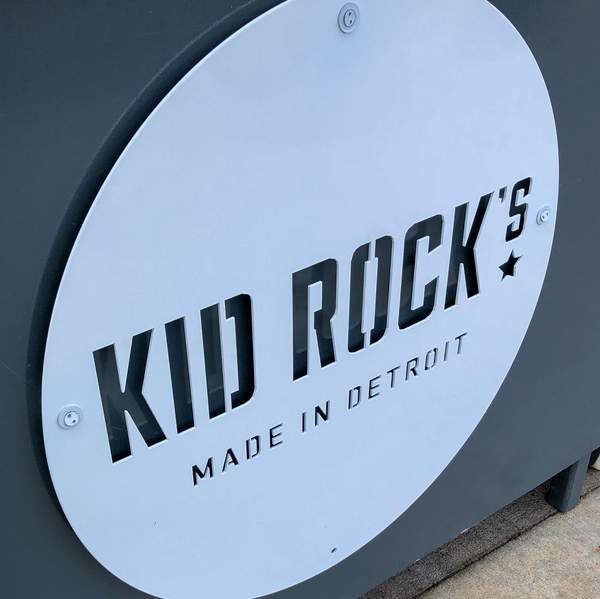 Custom laser-cut steel signs with powder-coated finish