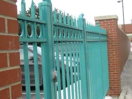 Ornamental steel fence with brick piers