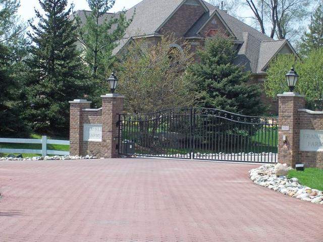 Custom steel estate gate with brick piers
