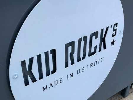 Laser-cut metal signage