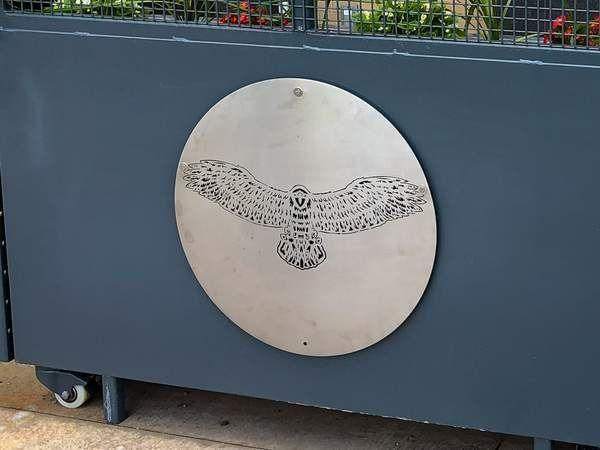 Laser-cut steel medallion on rolling planter