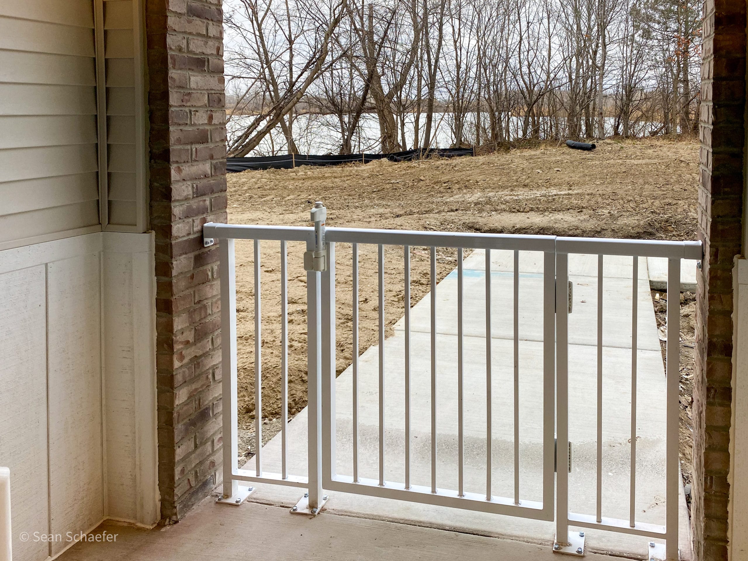 Custom metal (aluminum ACR4500®) guardrail and swing gate at Stone Ridge of Shelby Apartments