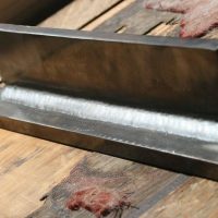 Metal fabrication using flux-cored arc welding